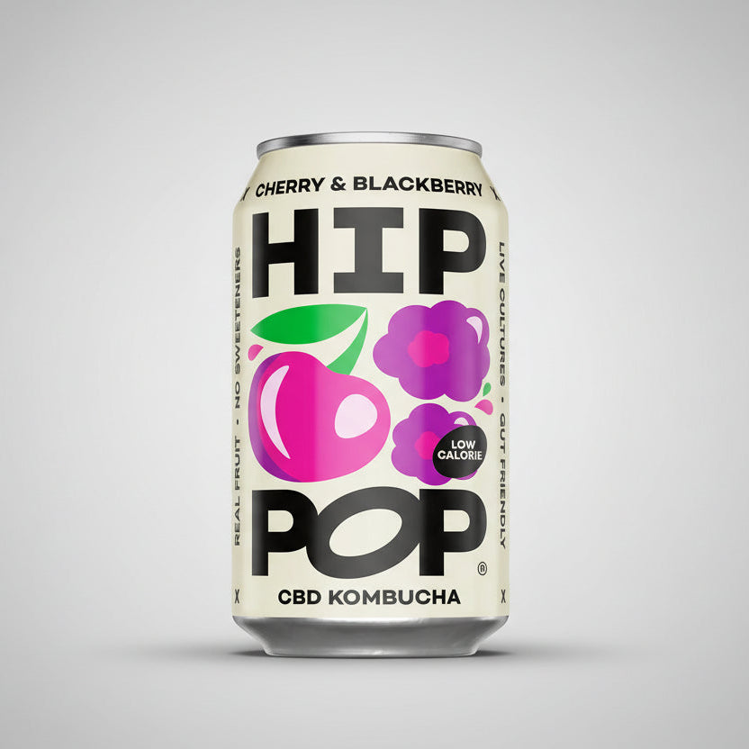 Can of Cherry & Blackberry HIP POP CBD Kombucha on a pink background