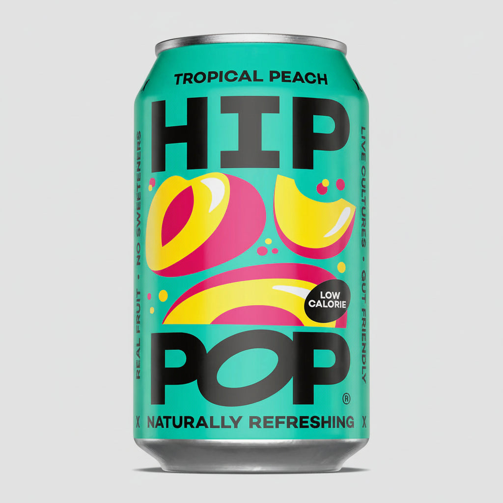 Can of Hip Pop Tropical Peach soda on a pink background